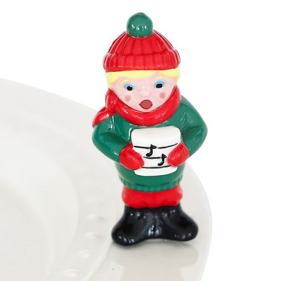 nora fleming caroler on the plate