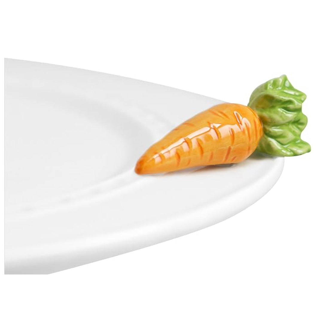 nora fleming 24 carrots on the plate