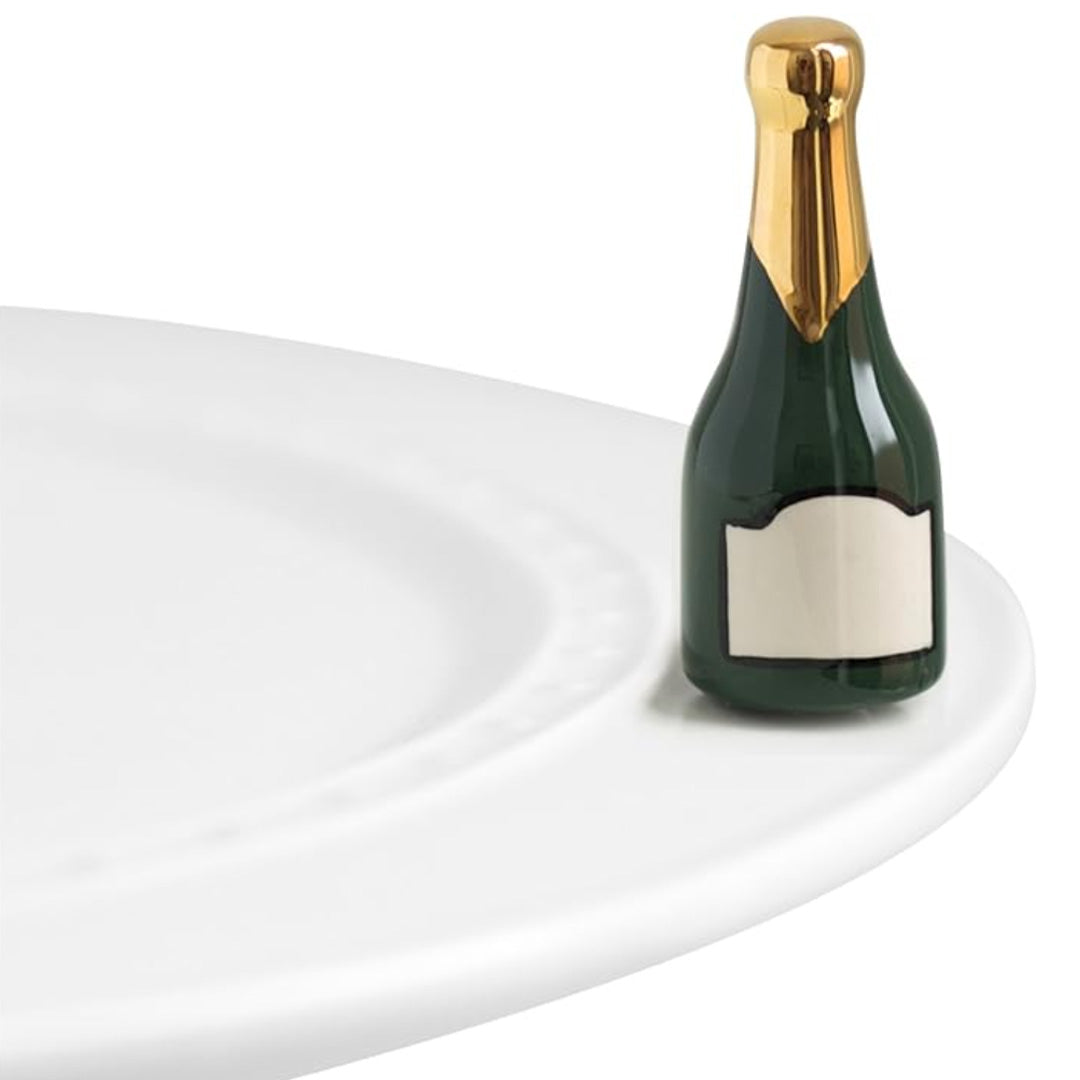 nora fleming champagne bottle on the plate