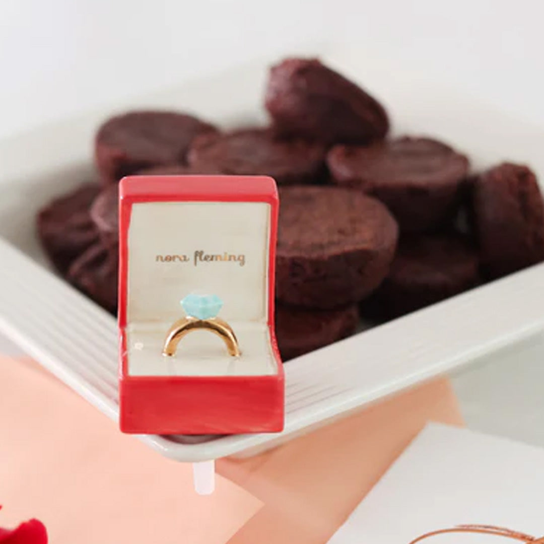 nora fleming diamond ring on the plate
