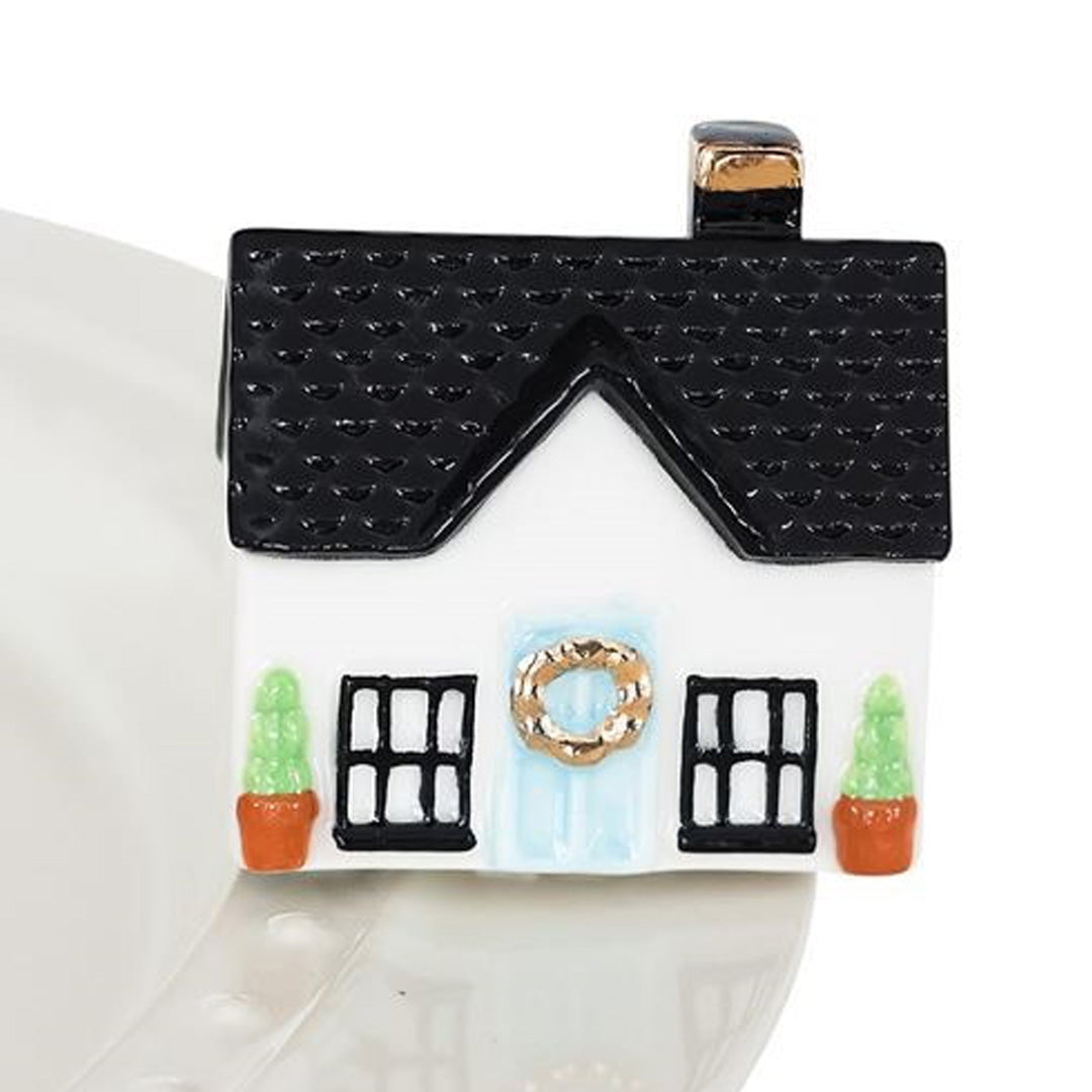 nora fleming house on the plate