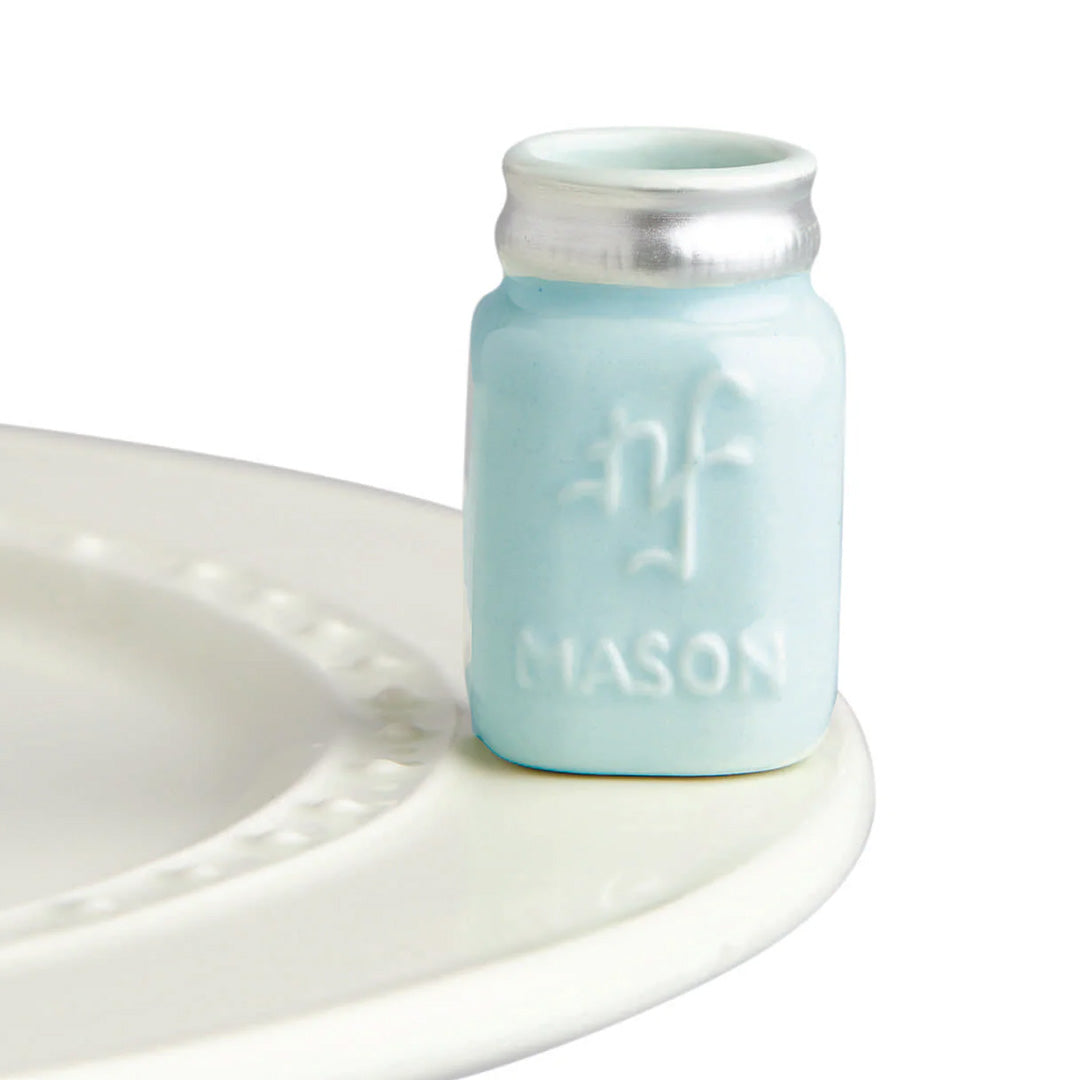 nora fleming mason jar on the plate