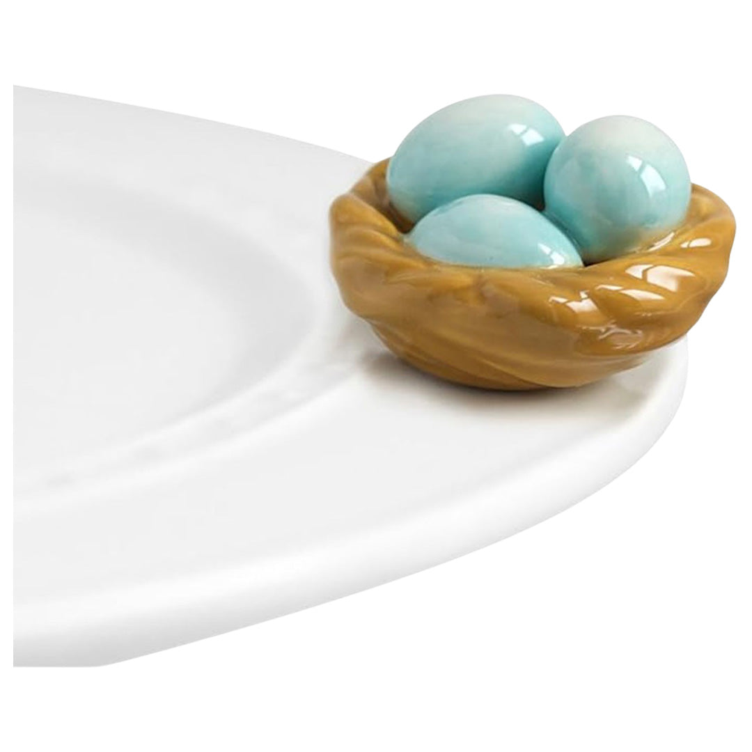 nora fleming nest on the plate