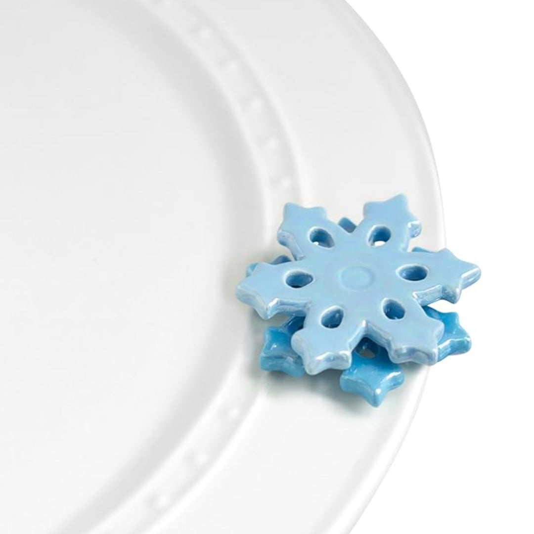 nora fleming snowflake on the plate