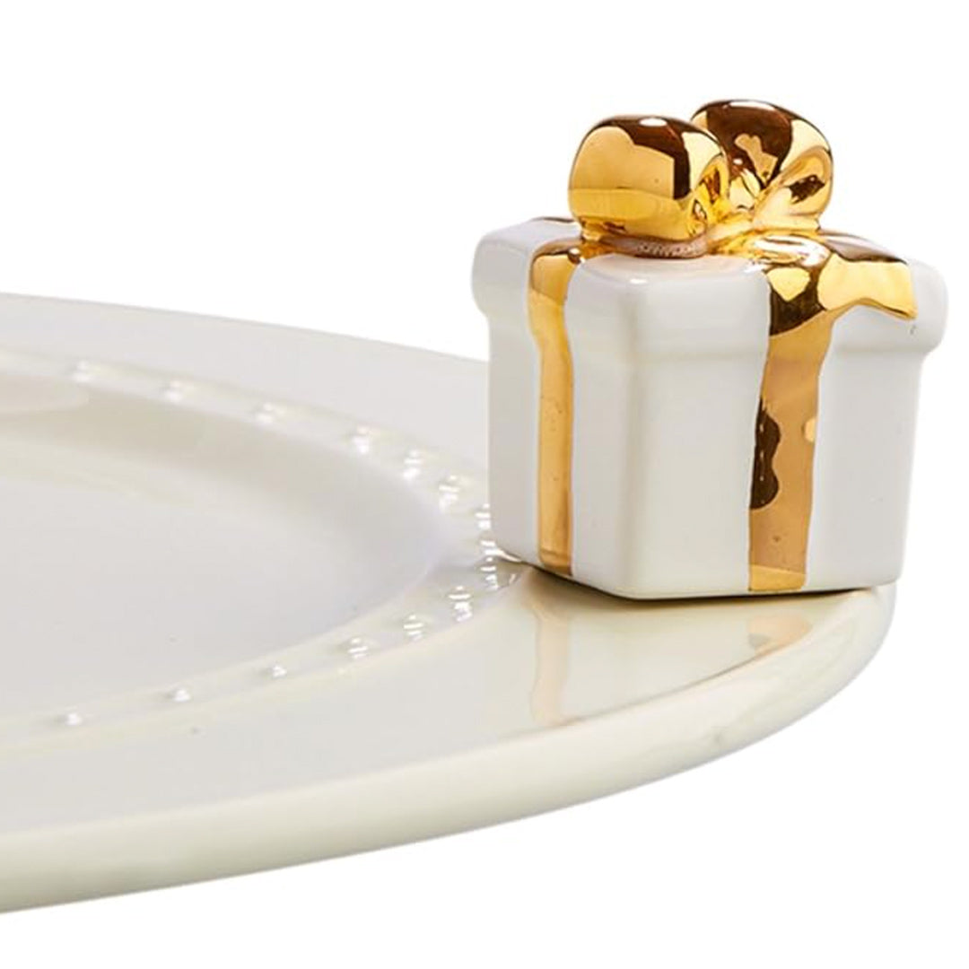 Nora Fleming White Gift Mini on the plate