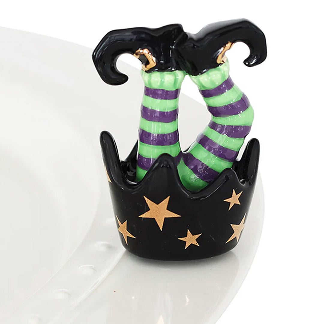 Nora Fleming Witch Feet Mini on the plate