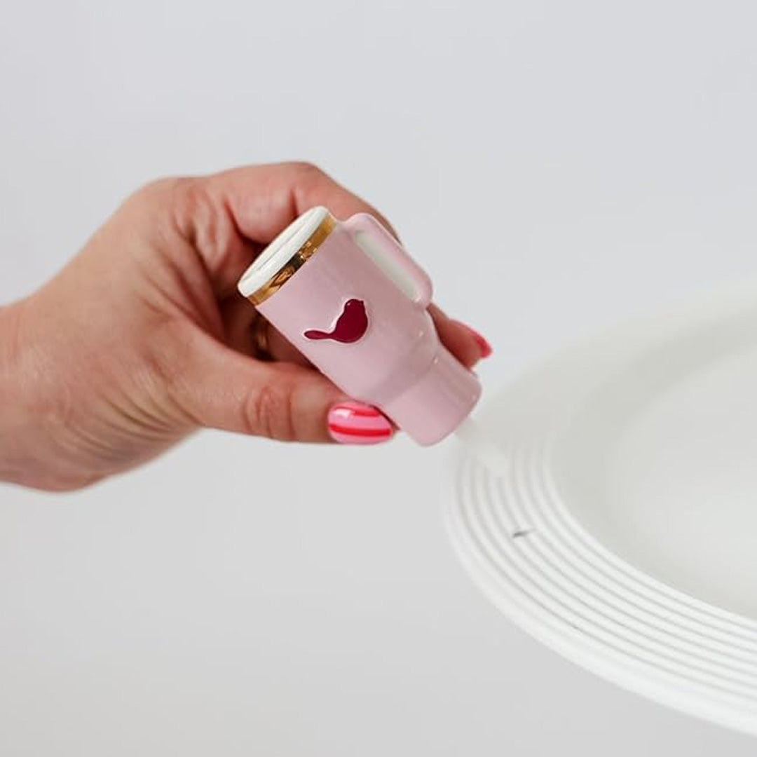 Nora Fleming sip happens Insulated Tumbler on the plate