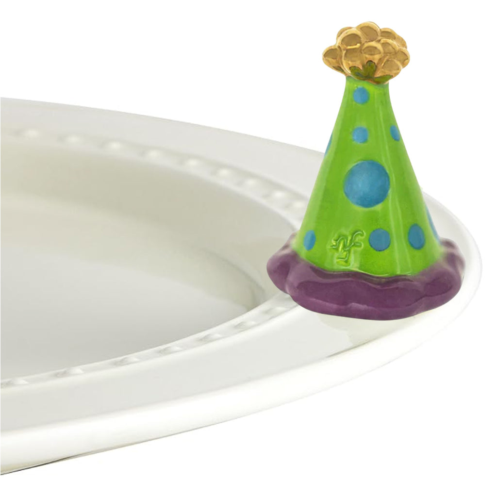 Nora Fleming Party Hat Mini on the plate