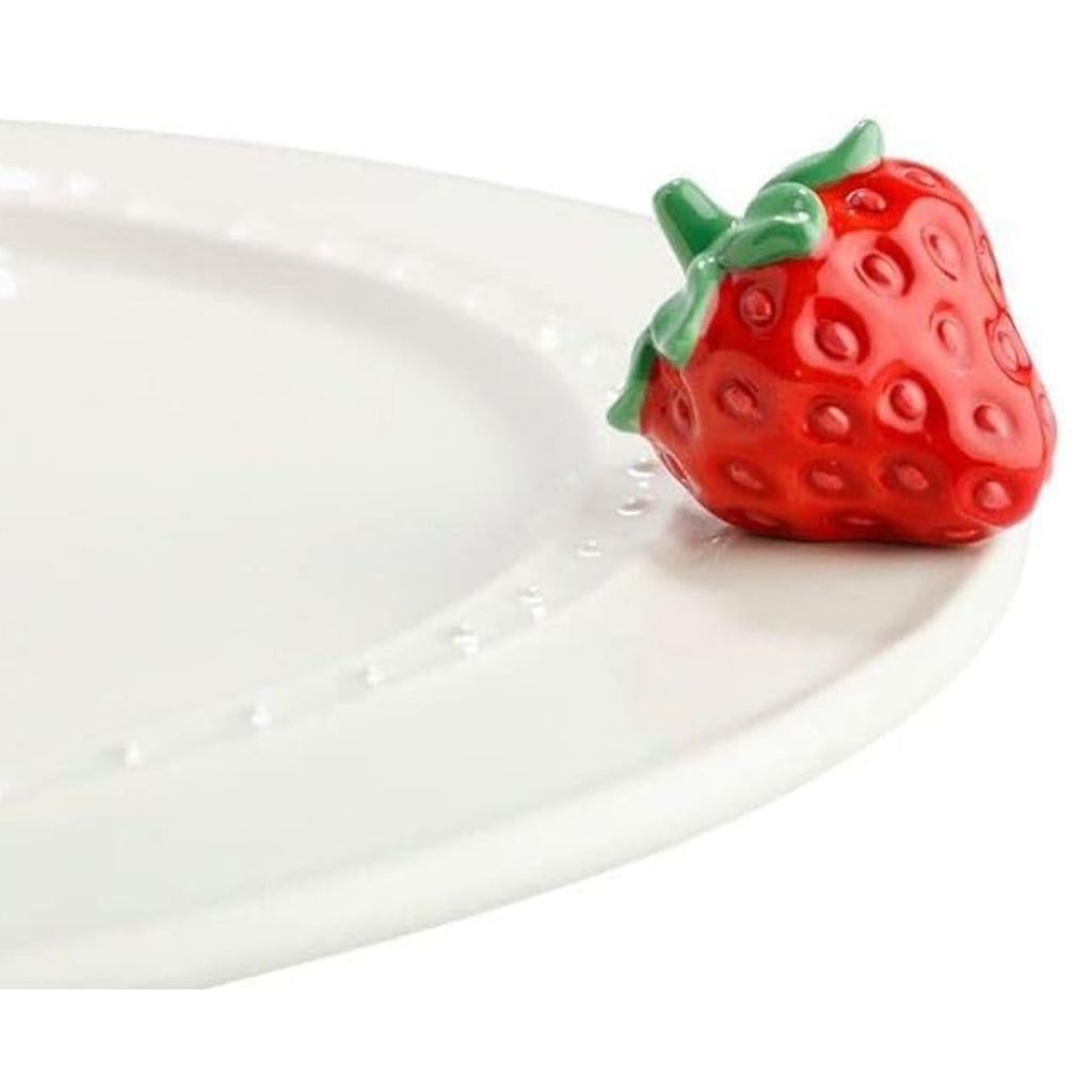 Nora Fleming Strawberry Mini on the plate