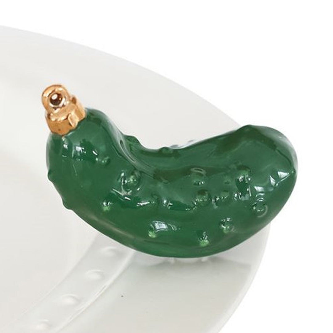 nora fleming Christmas pickle on the plate