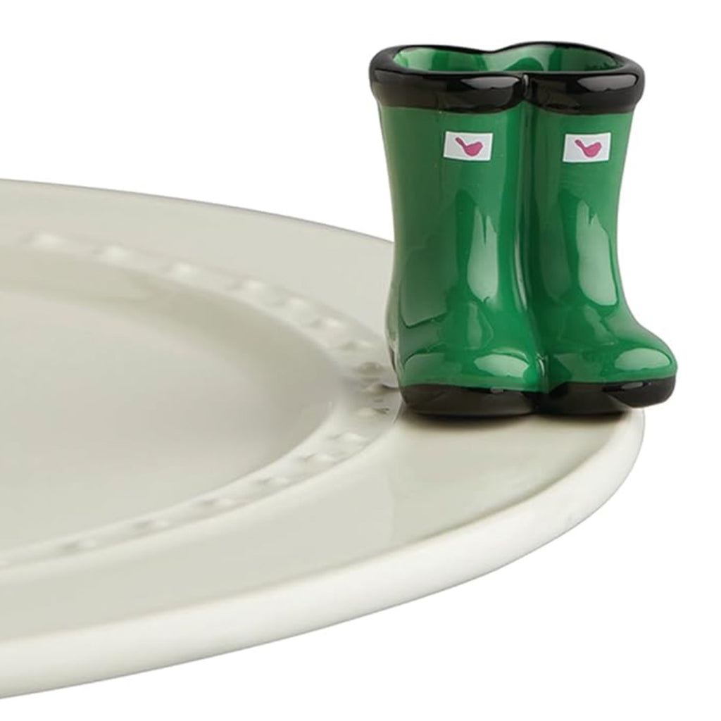 Nora Fleming Jumpin' Puddles Galoshes Mini on the plate