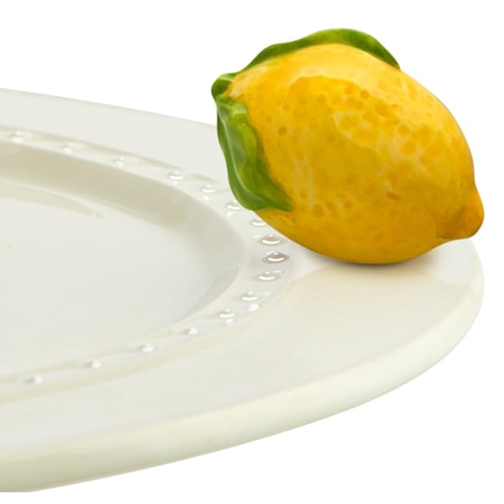 Nora Fleming Lemon Mini on the plate