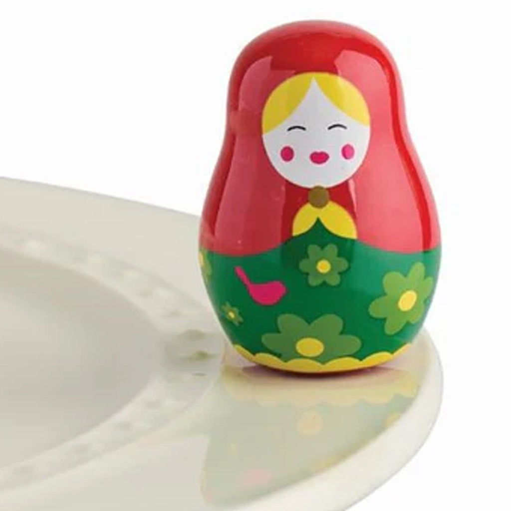 Nora Fleming Nesting Doll Mini on the plate