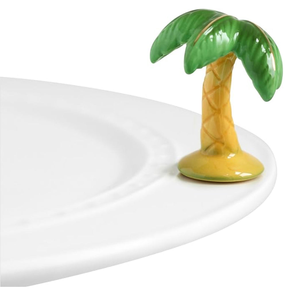 Nora Fleming Palm Tree Mini on the plate