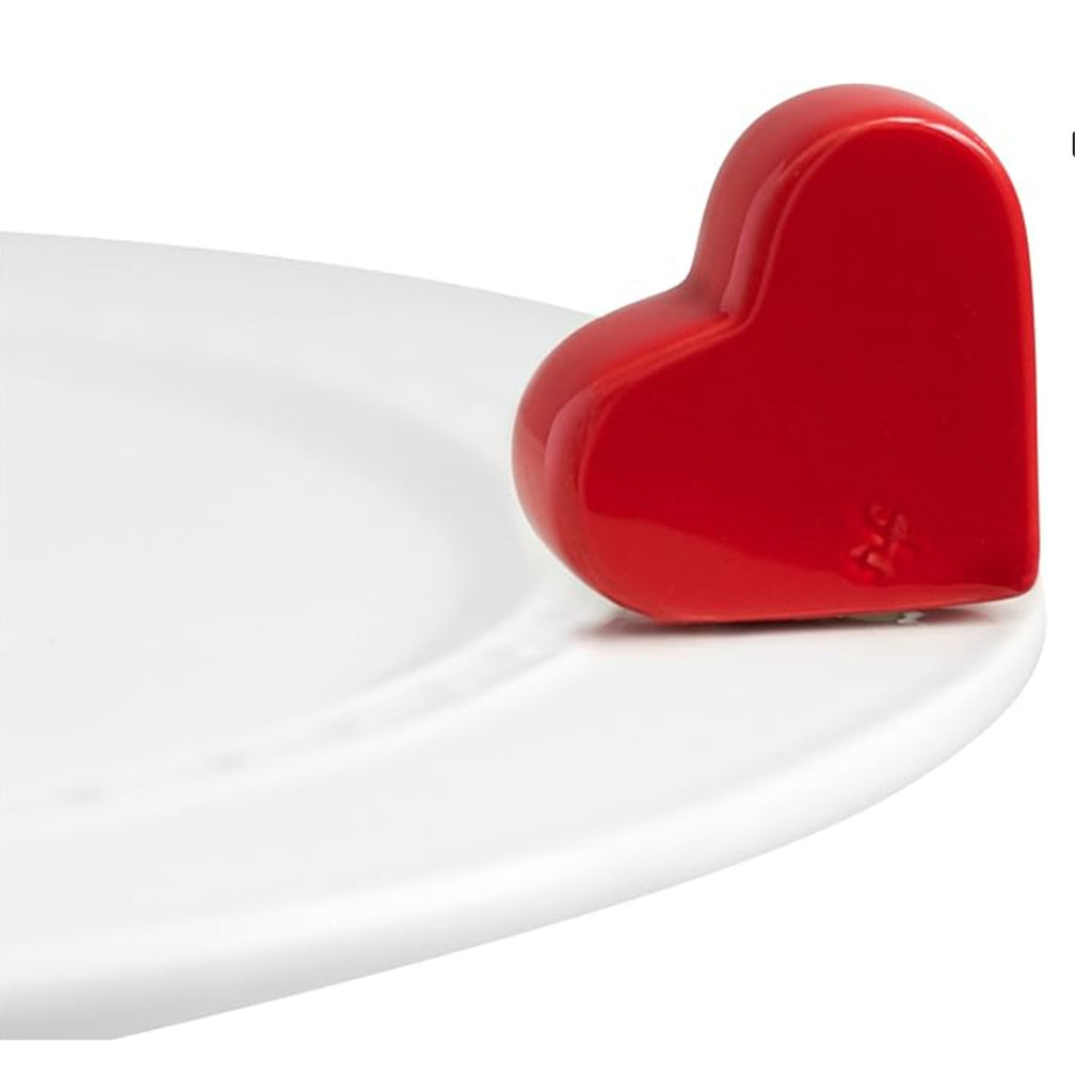 Nora Fleming Red Heart Mini on the plate