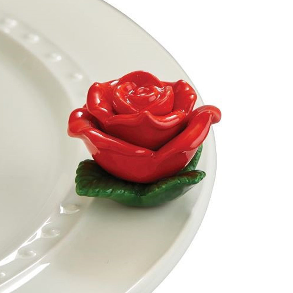 Nora Fleming Red Rose Mini on the plate