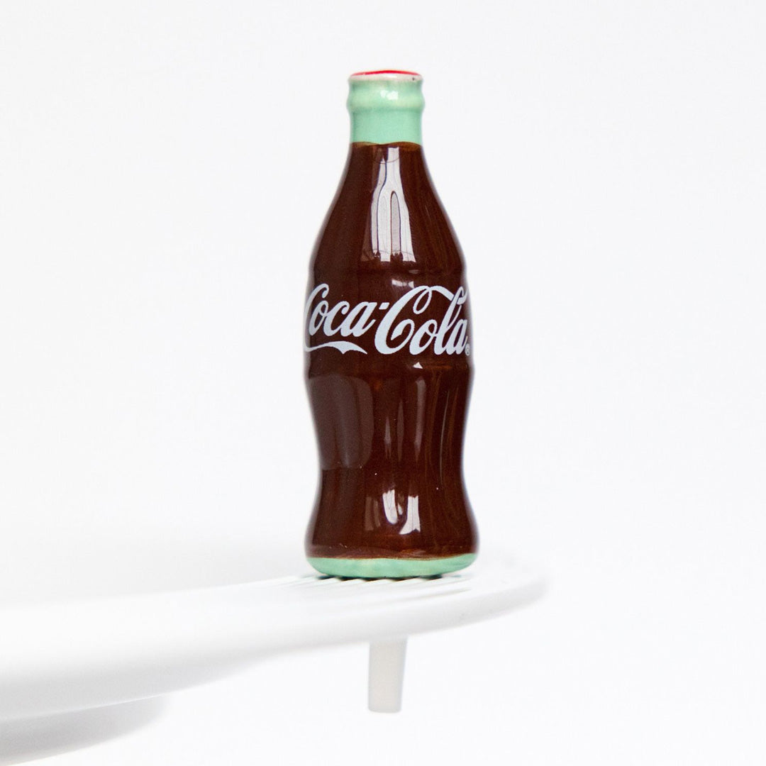 Coke® bottle on the plate