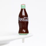 Coke® bottle on the plate
