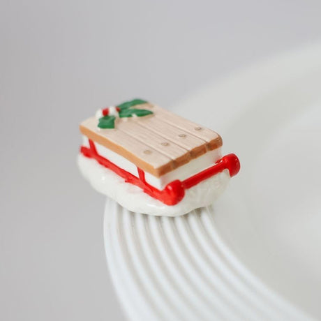 nora fleming ho ho whoa Vintage Sled on the plate